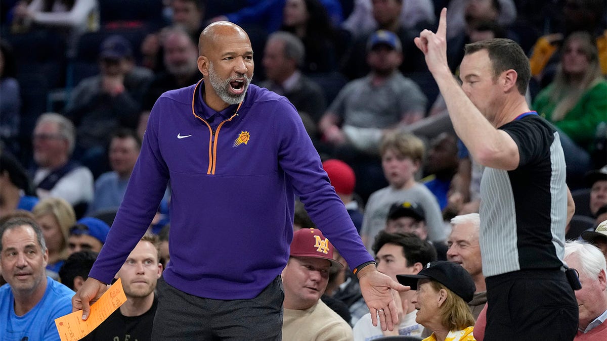 Monty Williams argues with an official