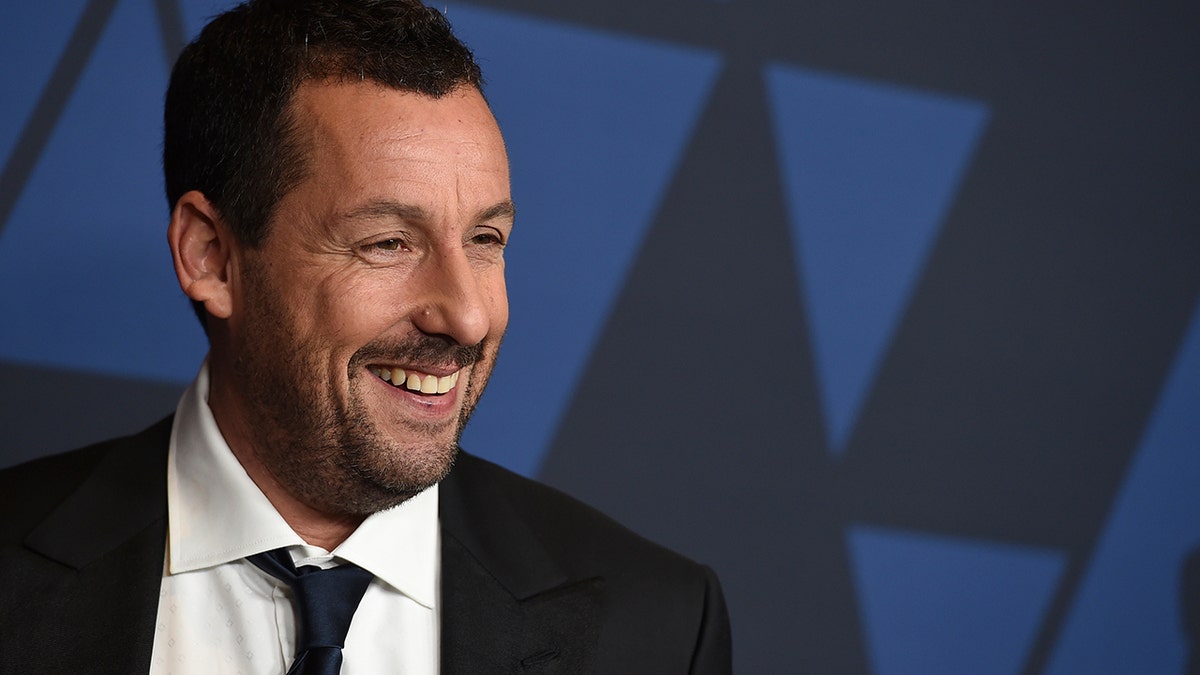 Adam Sandler receives Mark Twain Prize for comedy surrounded by co