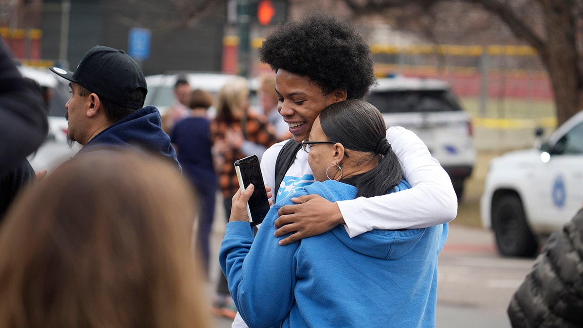 Mom hugs son after shooting at Denver high school