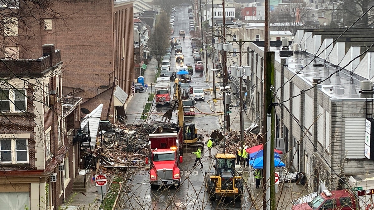 Rescue workers, rubble