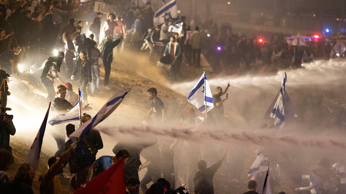 Authorities spraying water on protesters