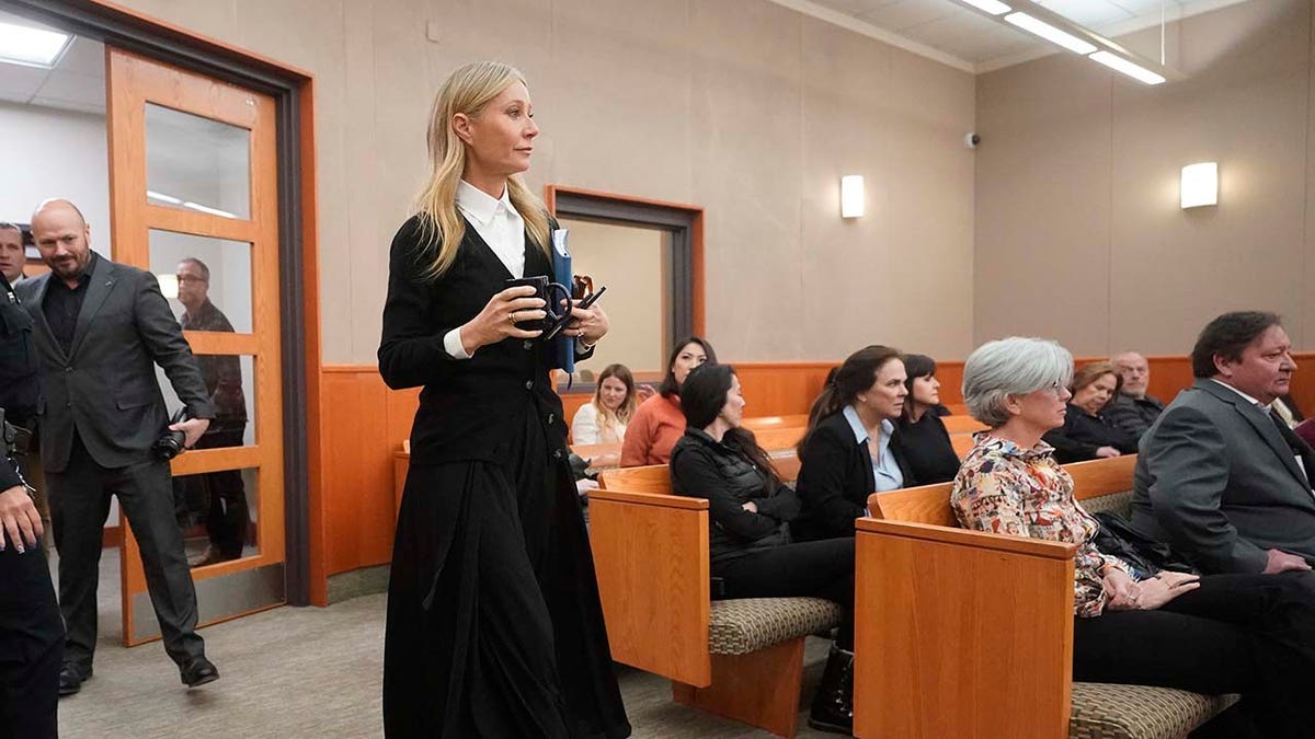 Gwyneth Paltrow wears long black dress and enters the courtroom for her trial