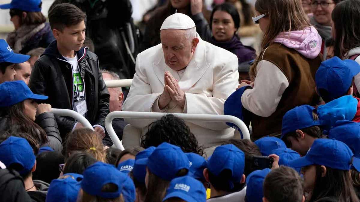 Pope Francis meets children