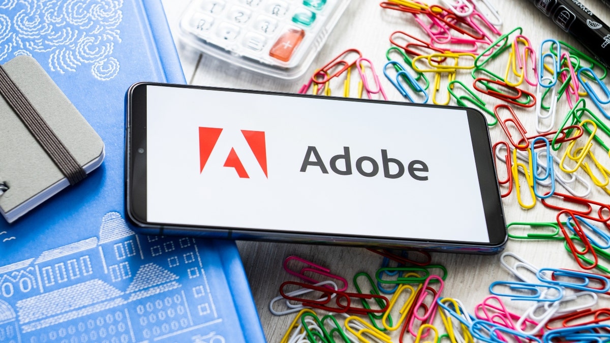 The Adobe logo on a smartphone