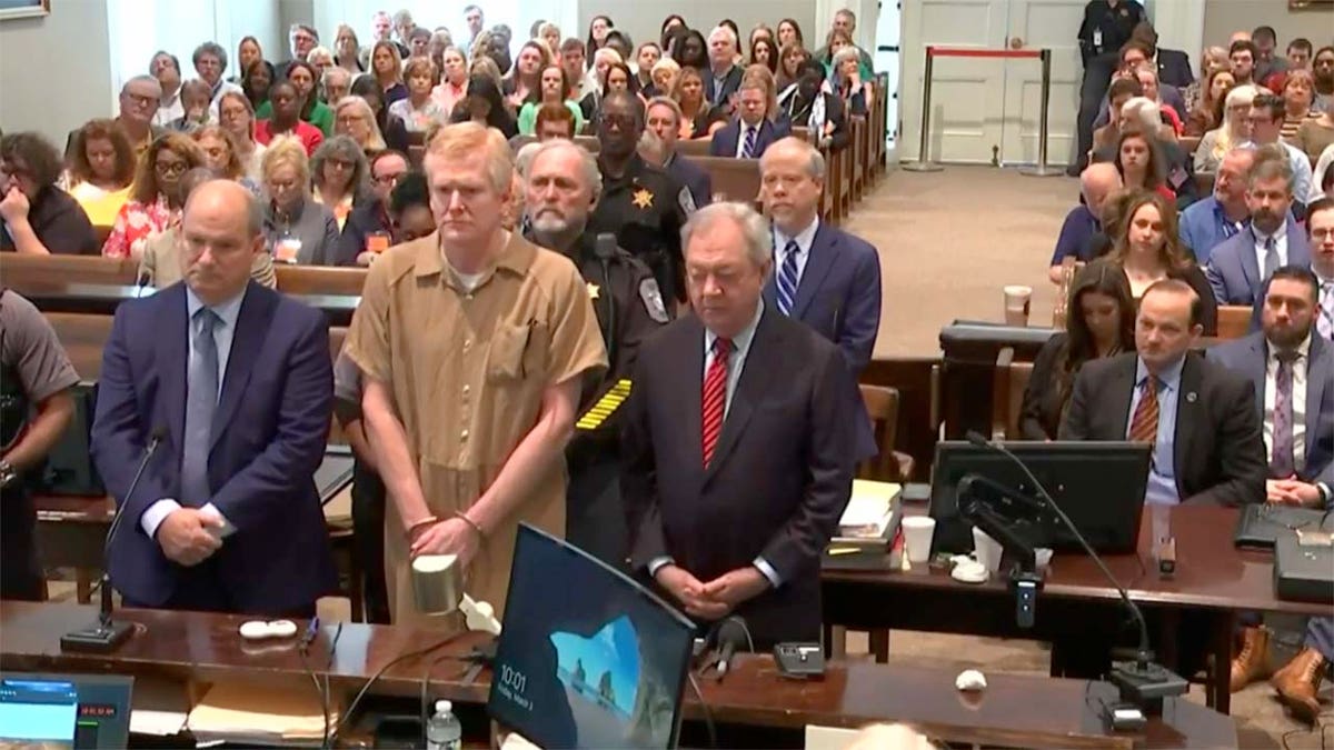 Alex Murdaugh stands with defense attorneys Jim Griffin and Dick Harpootlian during his sentencing at the Colleton County Courthouse in Walterboro, South Carolina on Friday, March 3, 2023. Murdaugh was found guilty of murdering his wife and son.