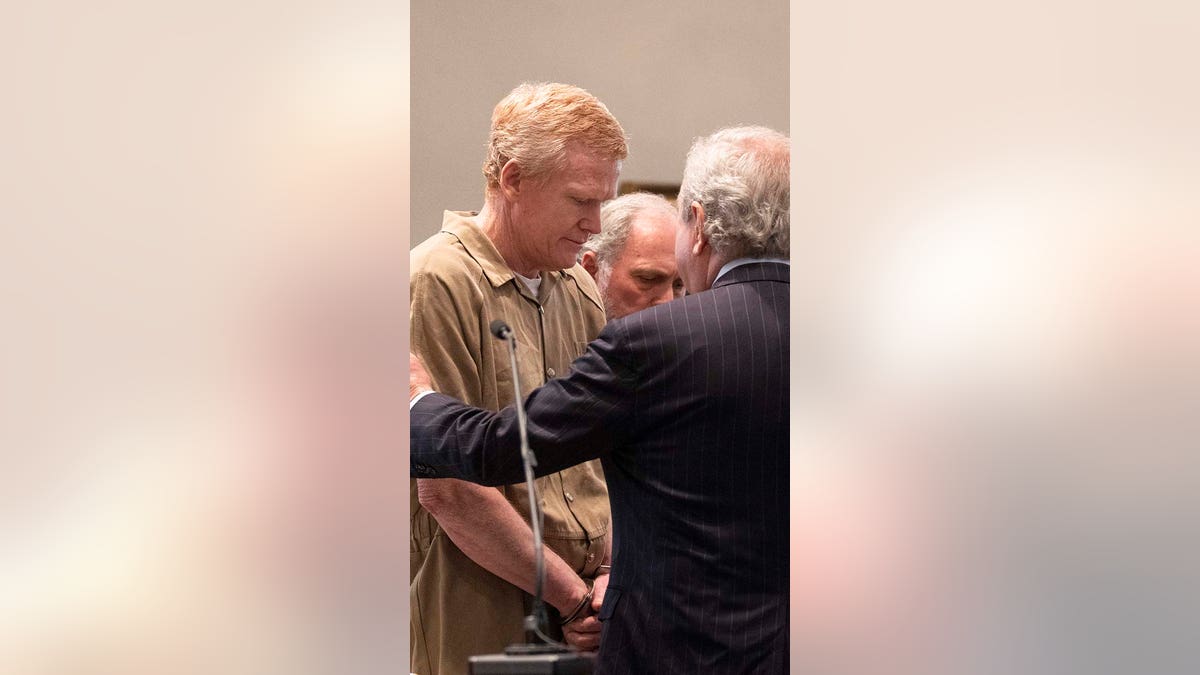 Alex Murdaugh attends his sentencing wearing a tan jumpsuit and handcuffs.