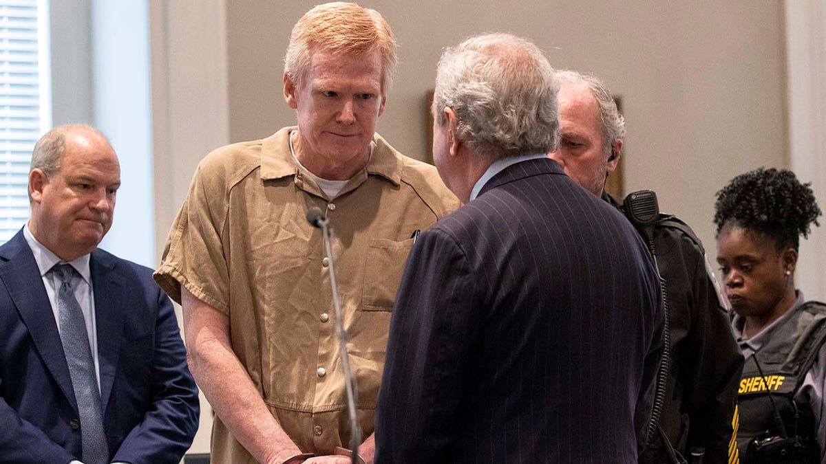 Alex Murdaugh attends his sentencing wearing a tan jumpsuit and handcuffs.