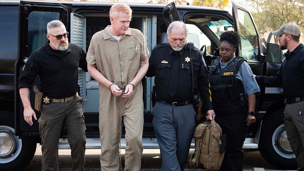 Alex Murdaugh attends his sentencing wearing a tan jumpsuit and handcuffs.