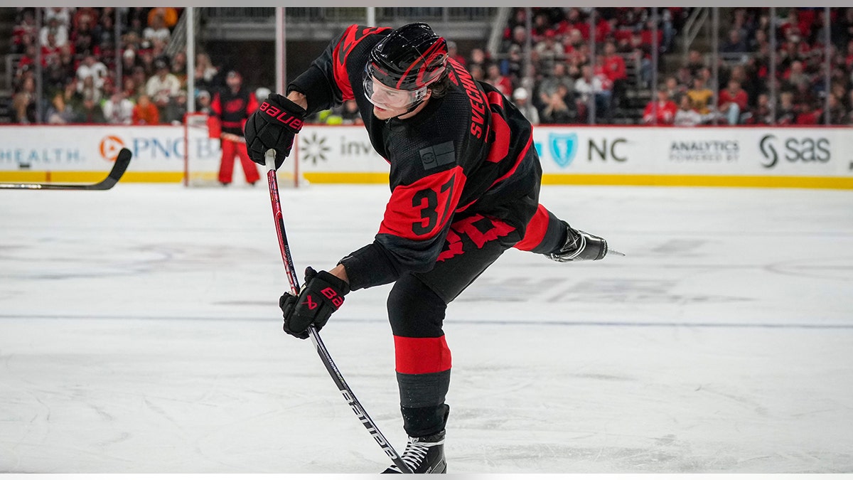 Andrei Svechnikov shoots puck