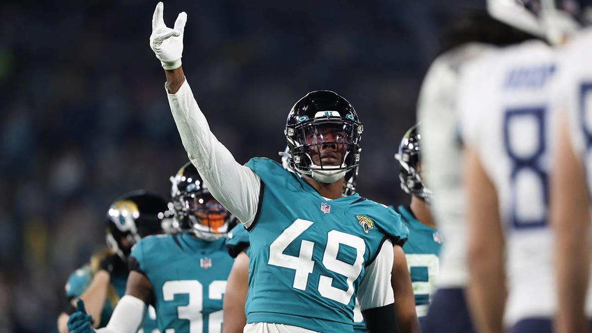 Jacksonville Jaguars defensive end Arden Key (49) walks the