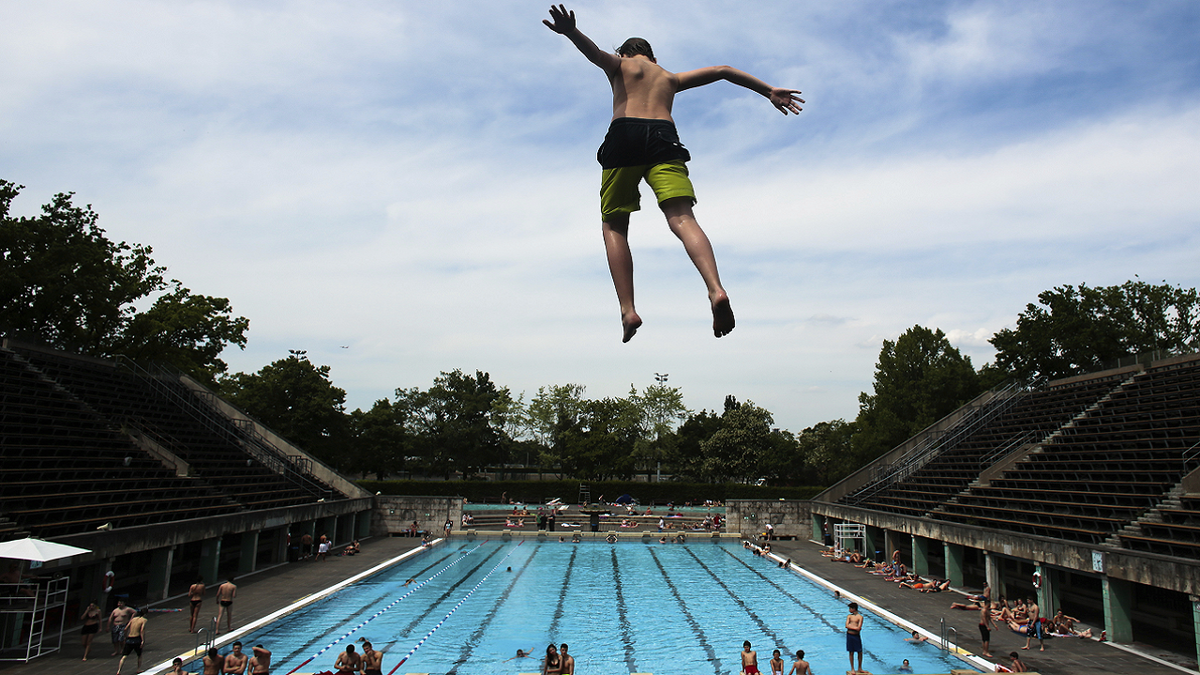 Jumping into pool in Berlin, Germany