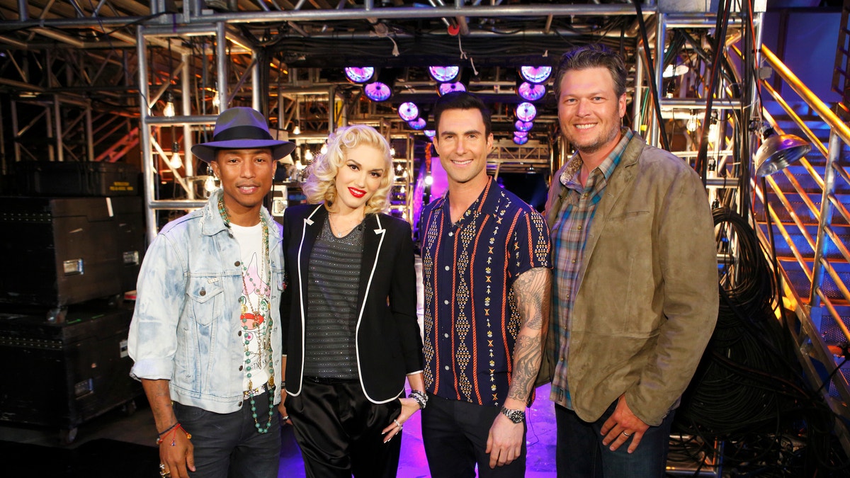 Gwen Stefani poses with Pharrell Williams, Adam Levine and Blake Shelton on The Voice
