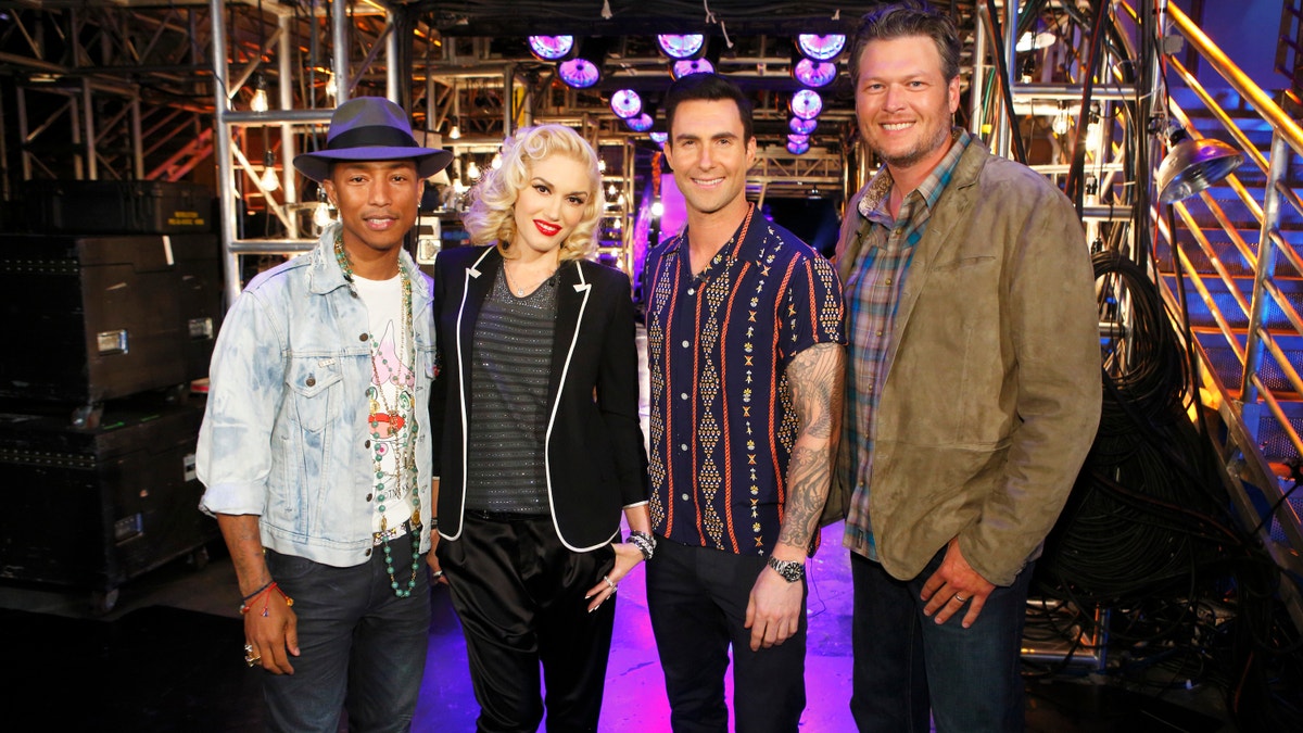 Gwen Stefani poses with Pharrell Williams, Adam Levine and Blake Shelton on The Voice