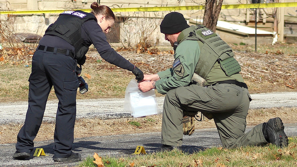 Investigators searching outside Tim Bliefnick's home on March 1