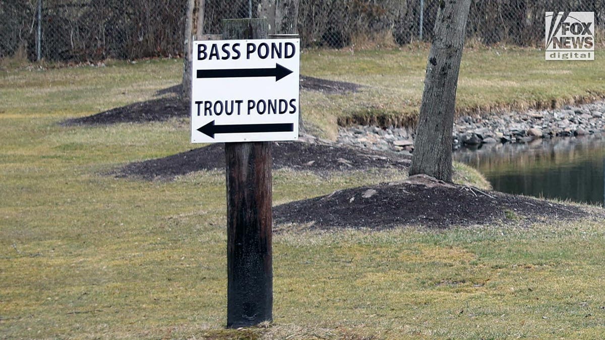 Sign showing arrows to bass pond and trout ponds