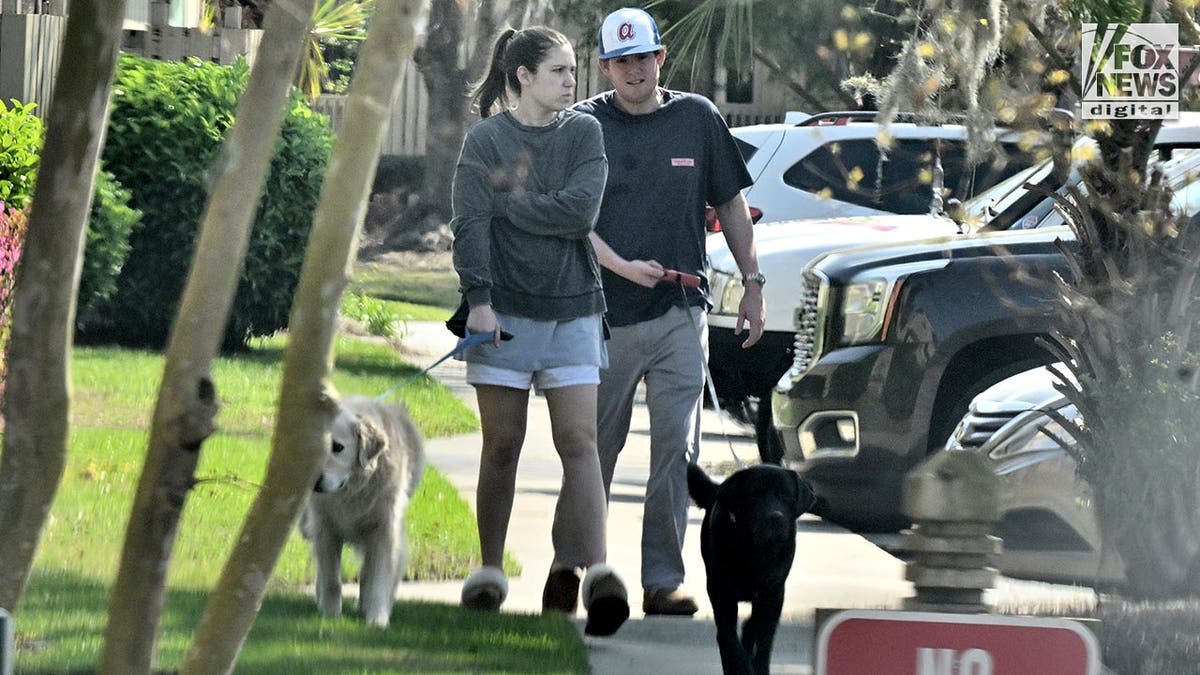 dog walking picture of Buster Murdaugh and Brooklynn White