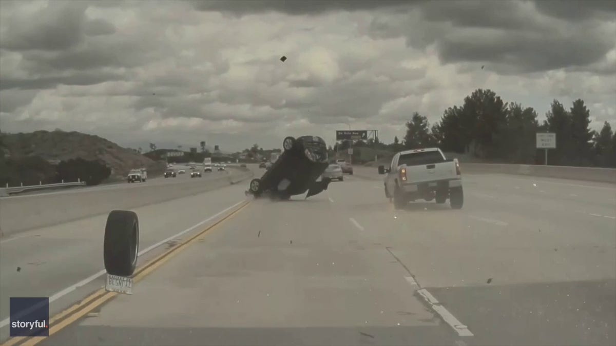 car lands on roof and rolls over