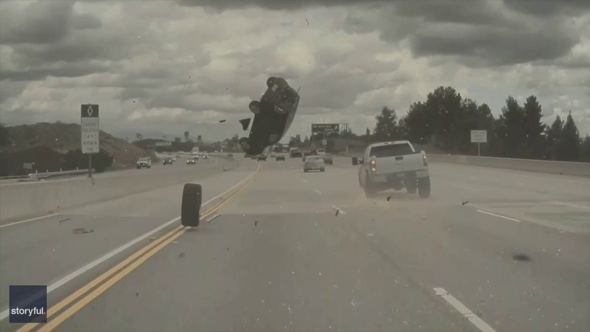 car flips over in the air on freeway