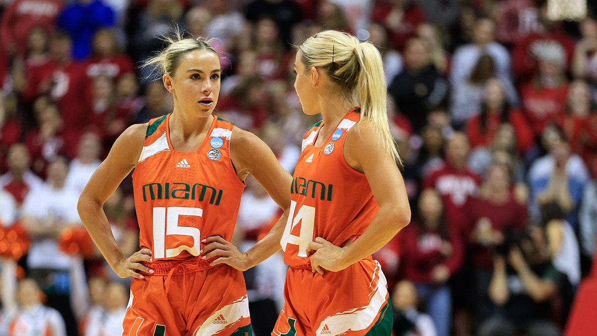 Haley and Hanna Cavinder talk on court