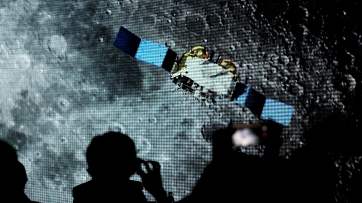 A screen shows footage of spacecraft for Chang'e-5 Mission