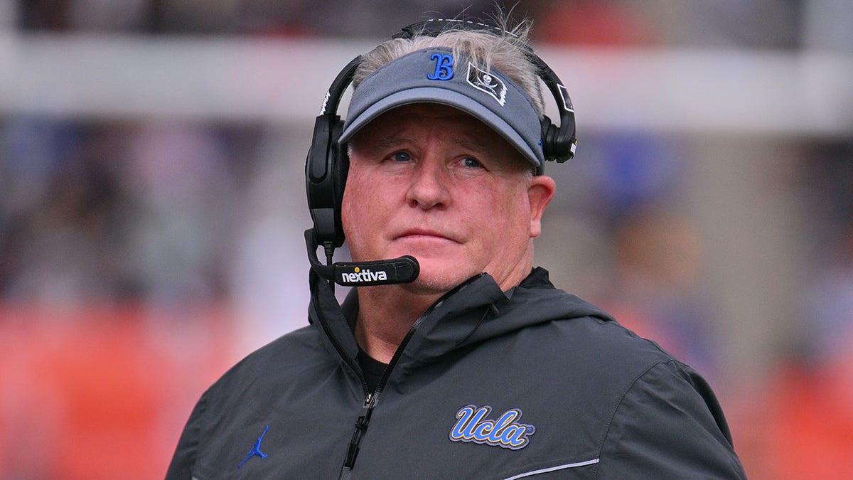 Head coach Chip Kelly of the UCLA Bruins looks on during a game