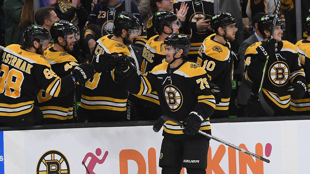 Connor Clifton celebrates with Bruins