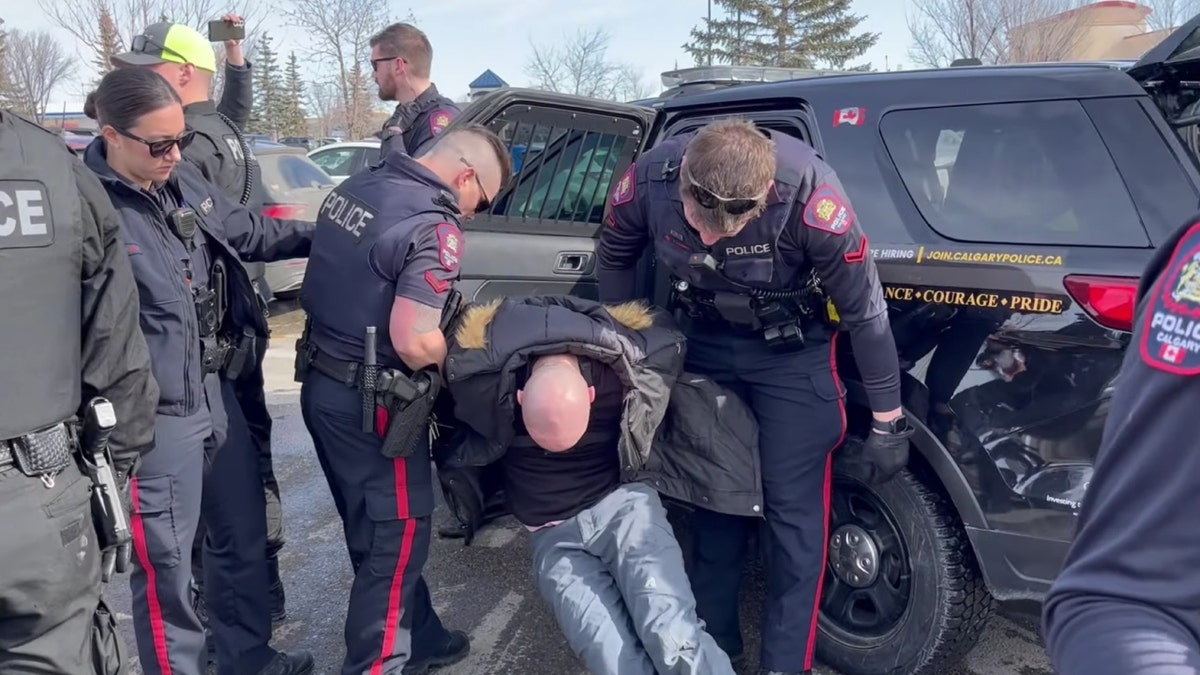 Derek Reimer, Canadian pastor, being arrested