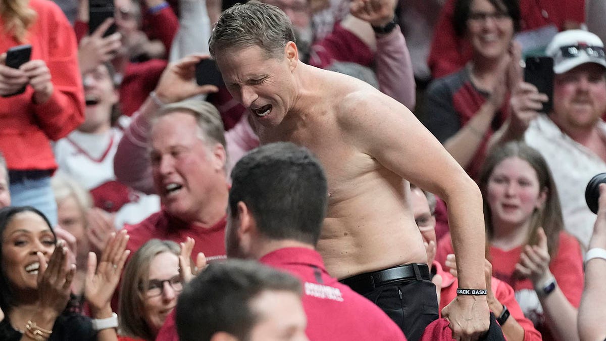 Eric Musselman goes viral for ripping shirt off after Arkansas upsets  Kansas