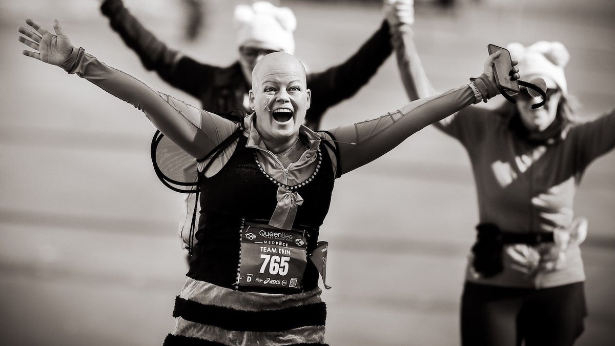 Erin Gratsch crossing the Queen Bee finish line in October 2022