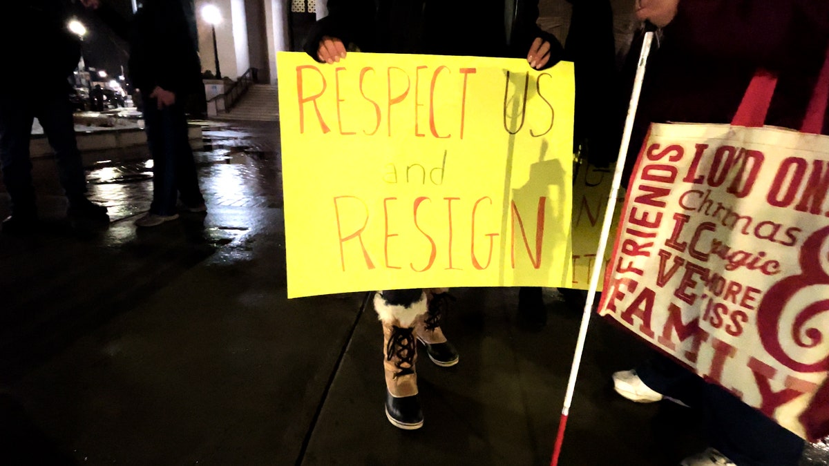 Sign outside Framingham city hall calling for Michael Hugo to resign