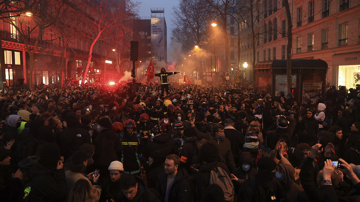 Protesters march during a rally in Paris on Thursday night.