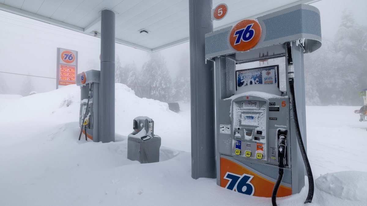 A gas station snowed in