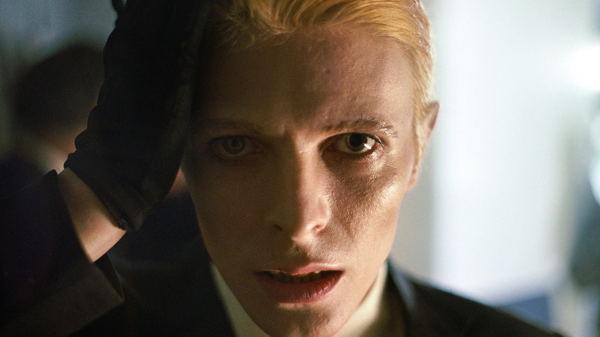 A close-up photo of David Bowie staring directly at the camera