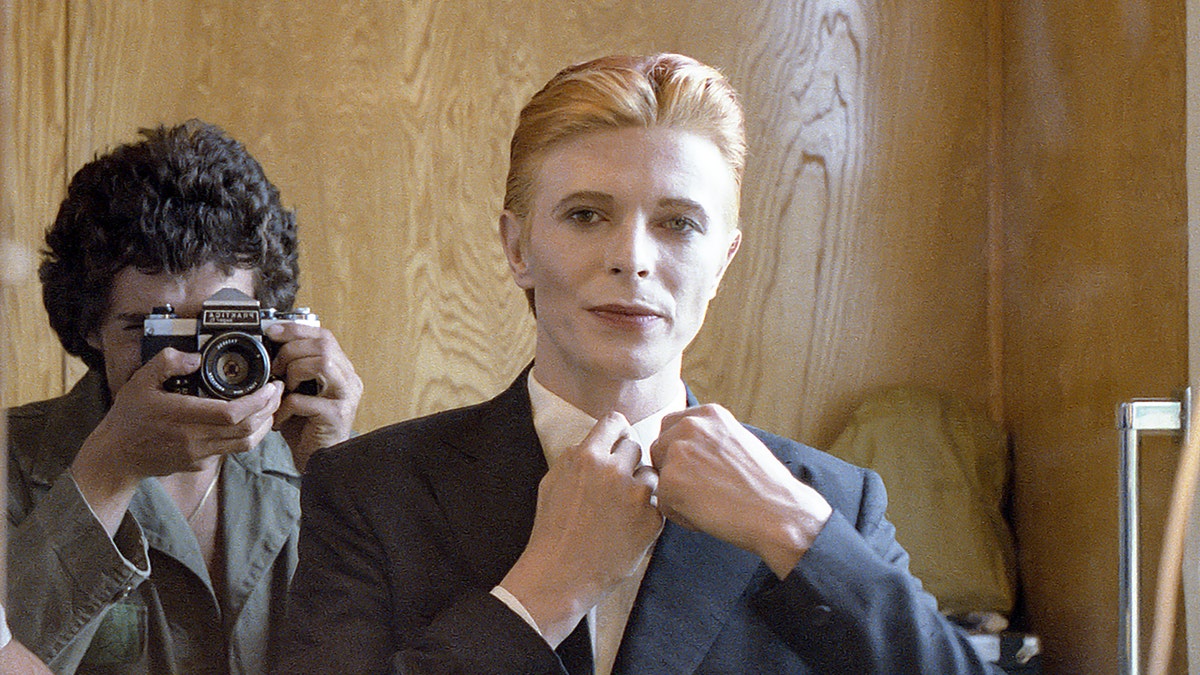 Geoff MacCormack photographing David Bowie in a mirror selfie