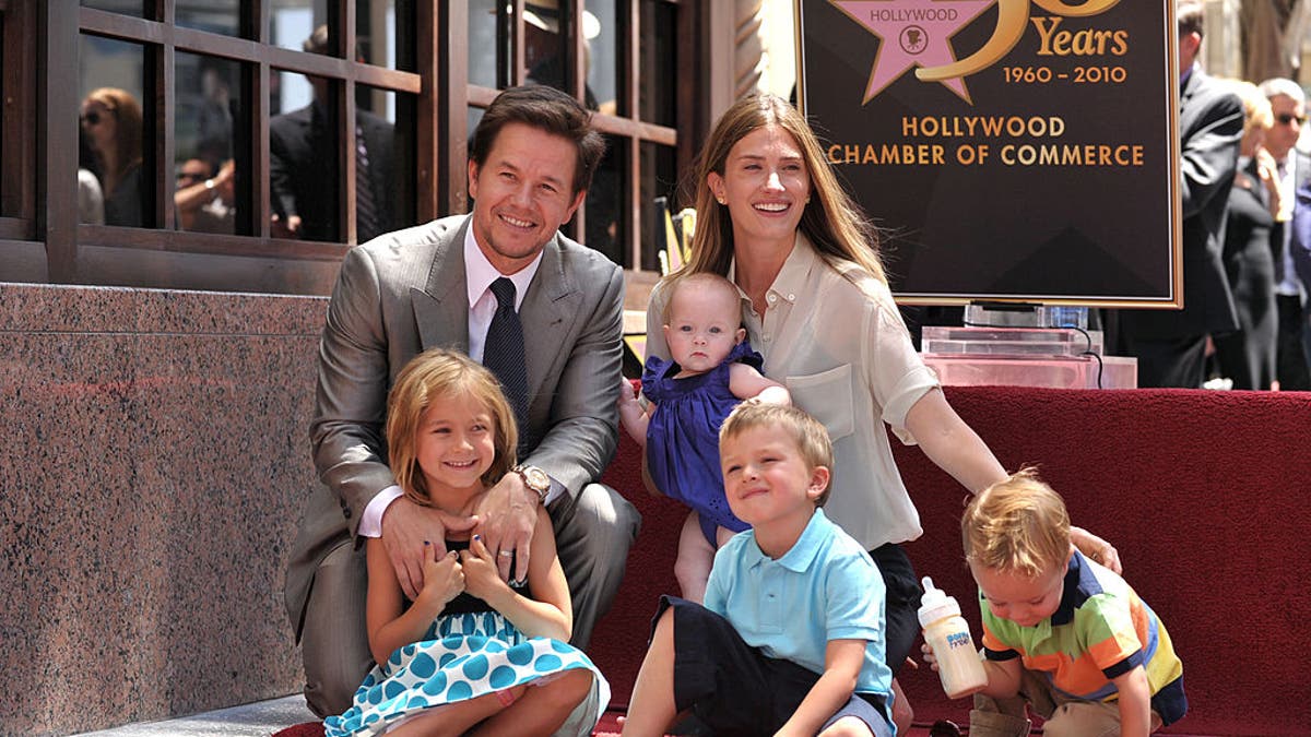 mark wahlberg with his family getting a star on the walk of fame