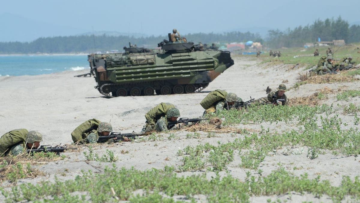 US Marines and Philippine marines on beach in joint exercise