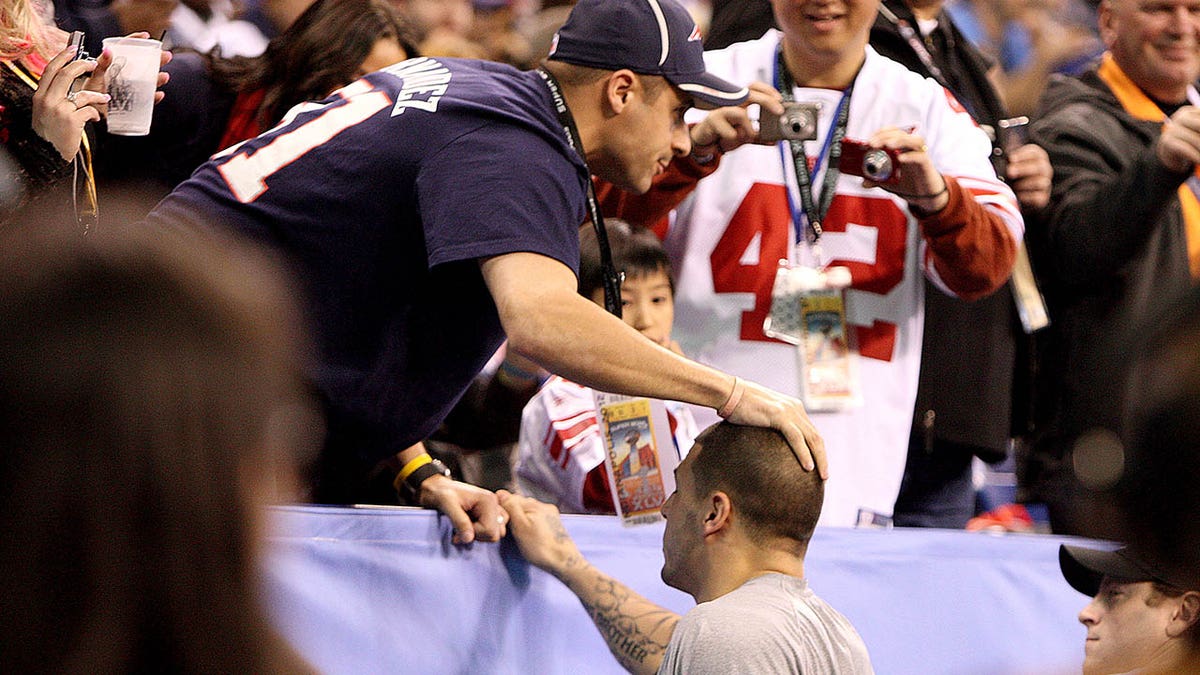Patriots player Aaron Hernandez greets his brother Super Bowl XLVI