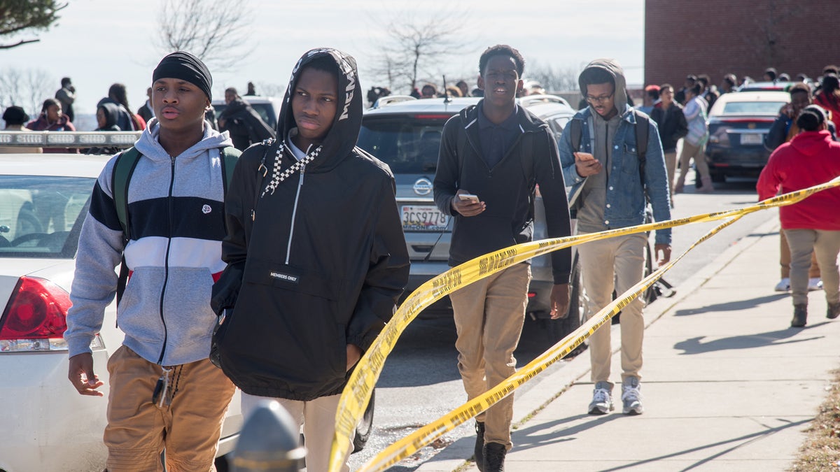 Baltimore high school students leave campus following a shooting