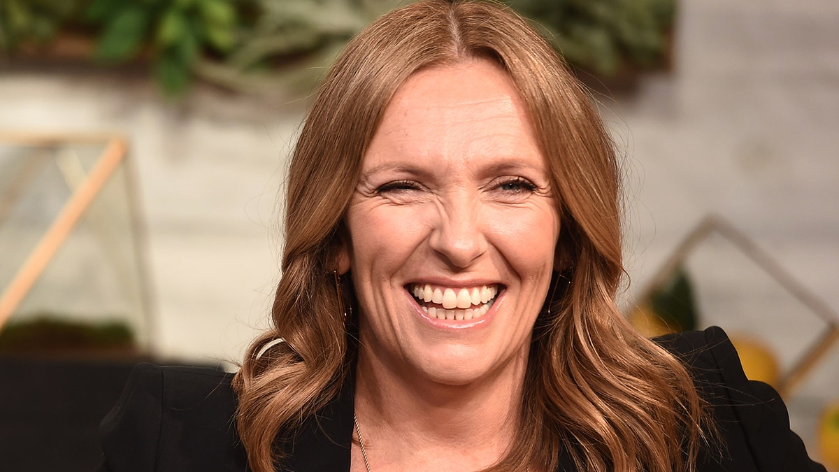 Toni Collette smiles in New York city wearing black at Buzzfeed studios