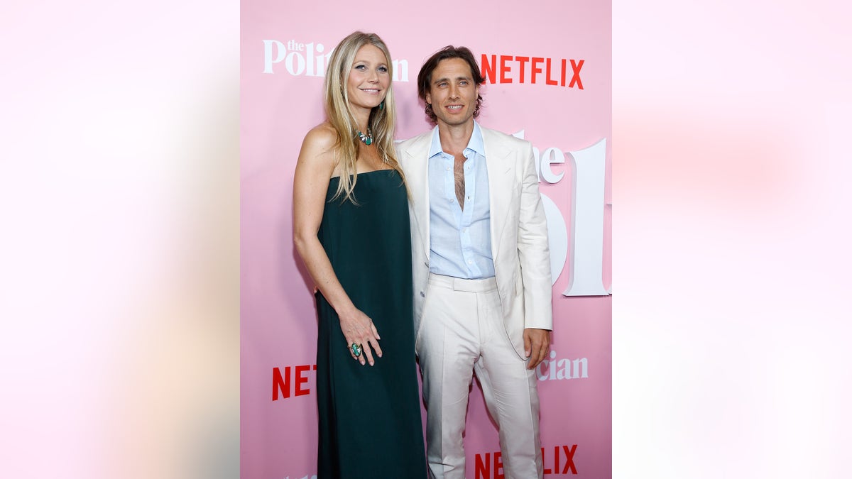 Gwyneth Paltrow and Brad Falchuk pose together on red carpet