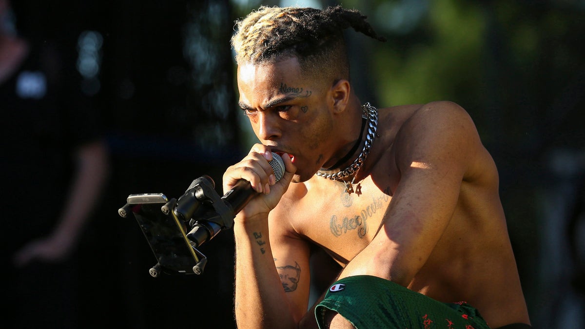 rapper XXXTentacion performing on stage