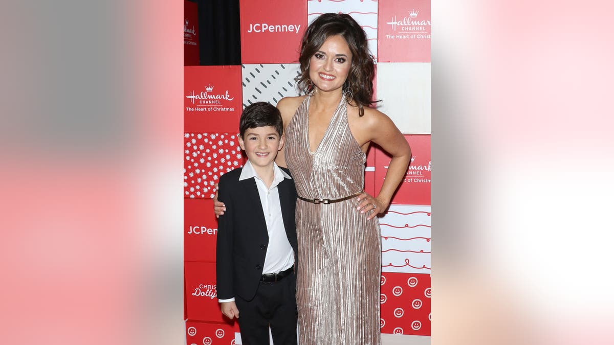 Danica McKellar posing with her son Draco