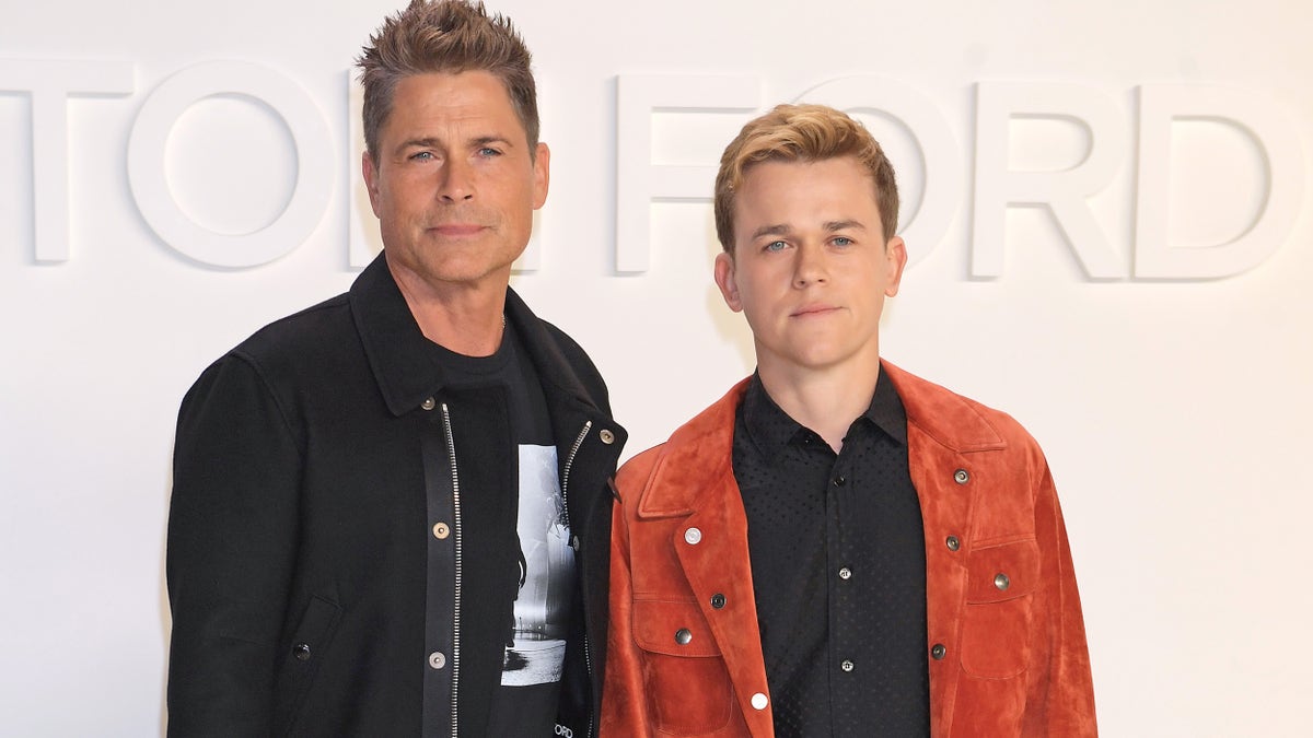 Rob Lowe in a black jacket with son John Owen Lowe