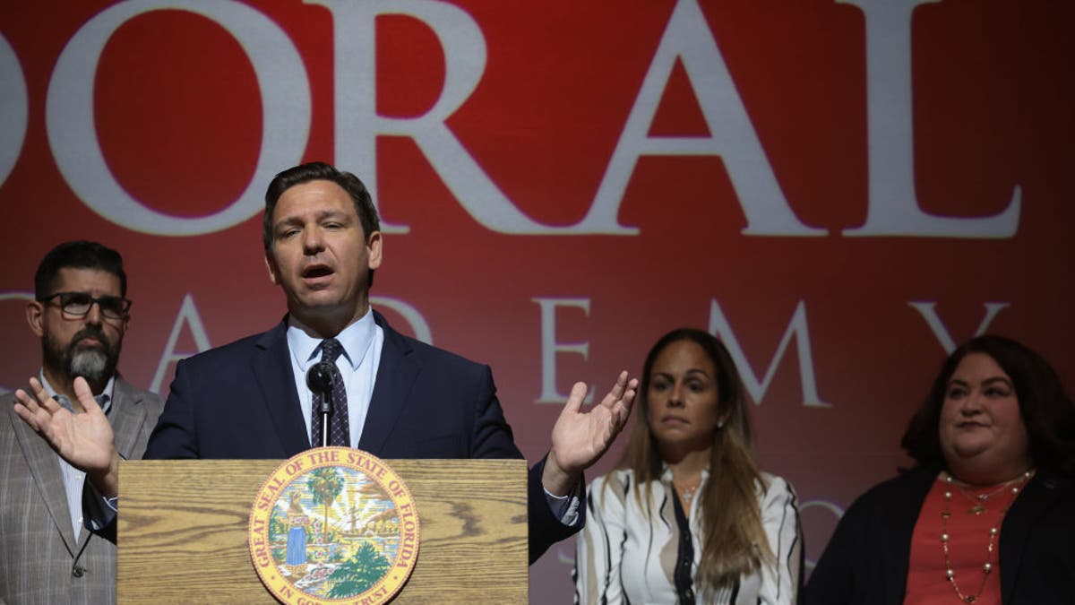 Gov. Ron DeSantis at lectern talking