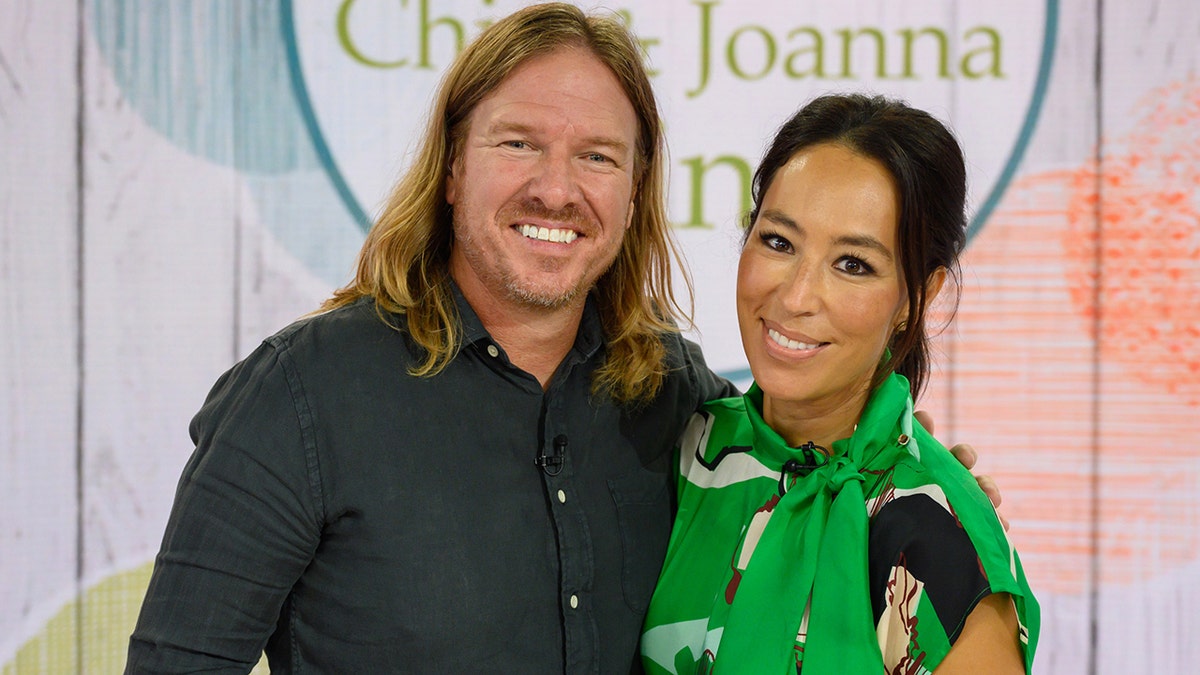 Chip and Joanna Gaines smiling into the camera