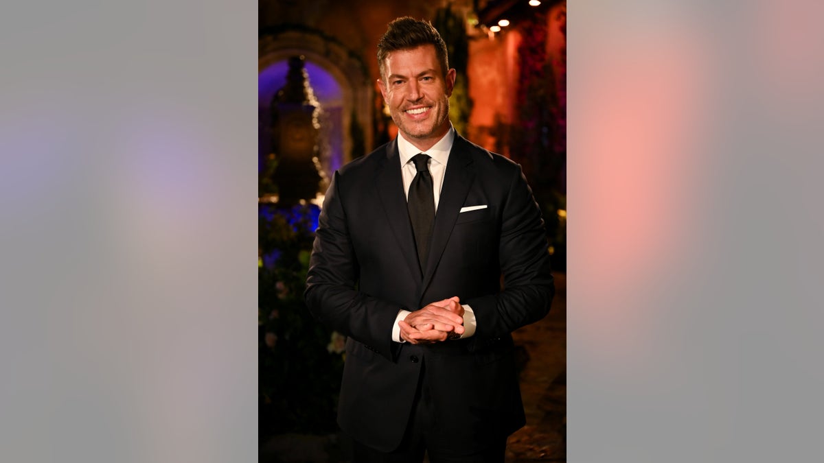 Jesse Palmer in a suit on the set of "The Bachelor"