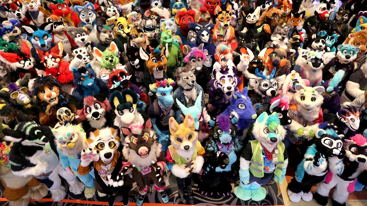 Group photo of people dressed as furries.