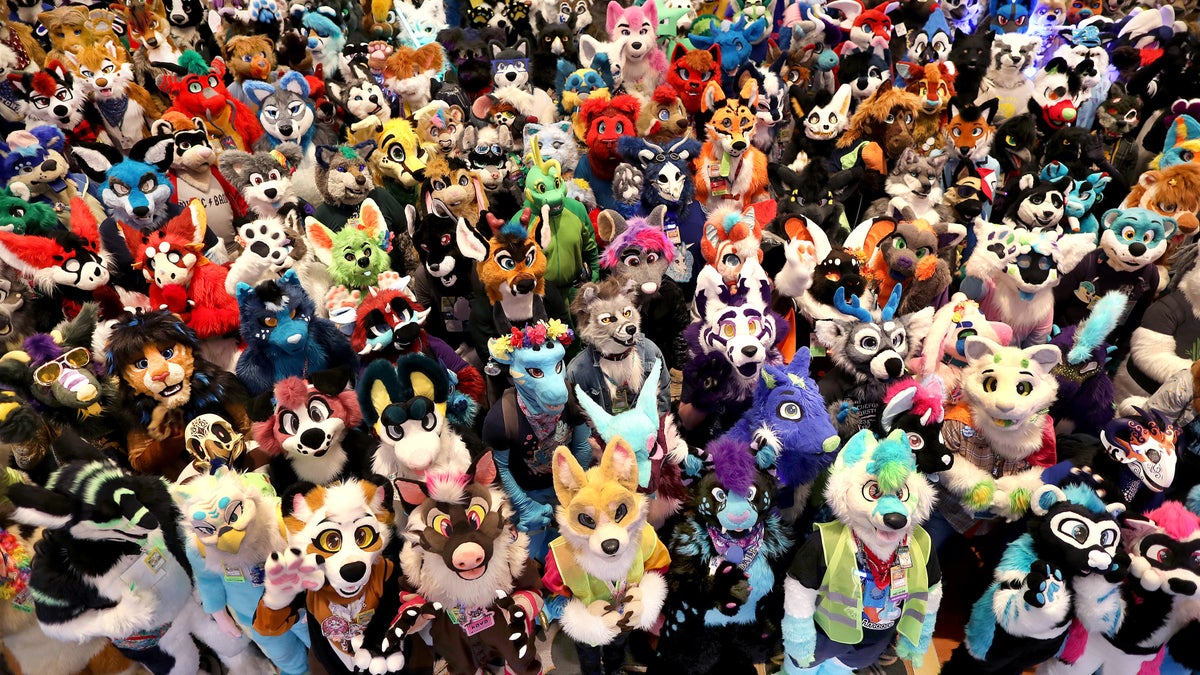 Group photo of people dressed as furries.