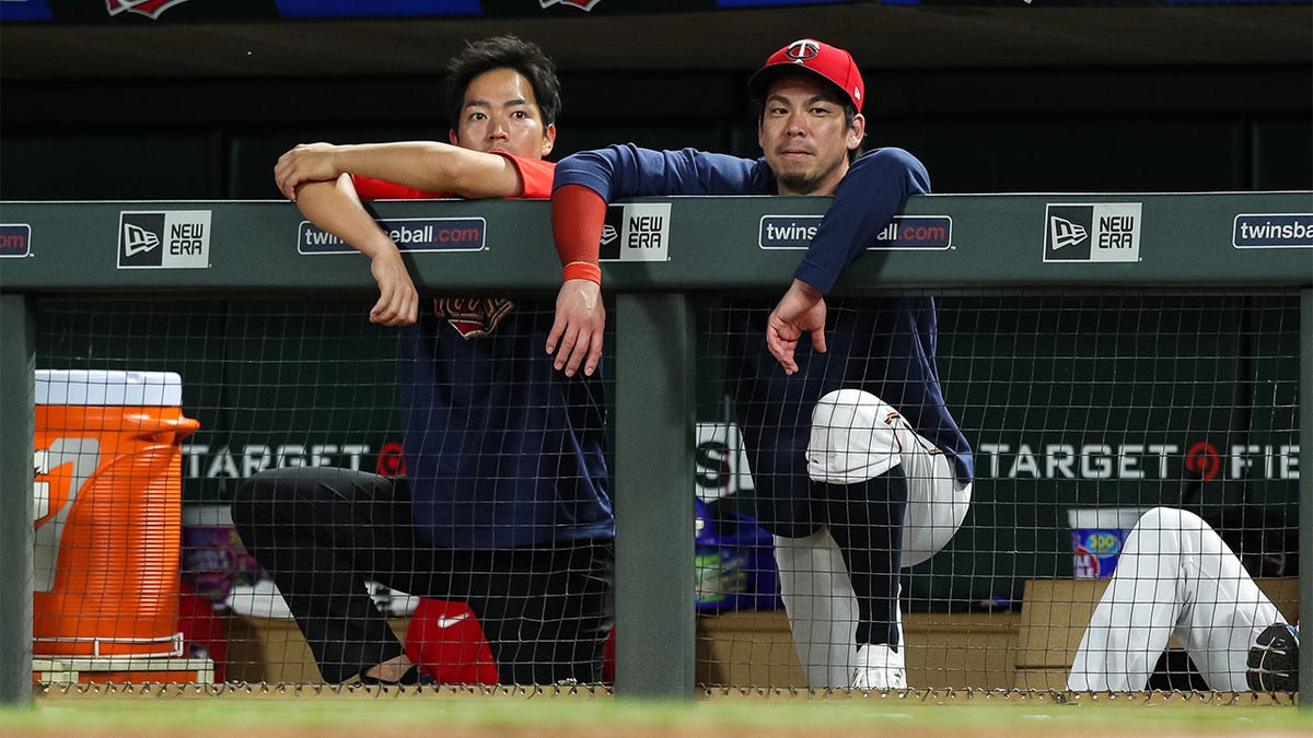 Kenta Maeda looks on from the dugout