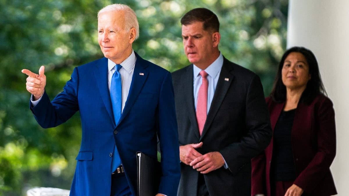 From left: President Biden, Secretary of Labor Marty Walsh and Deputy Secretary of Labor Julie Su exit the Oval Office for remarks in the Rose Garden of the White House in Washington, D.C., on Sept. 15, 2022.